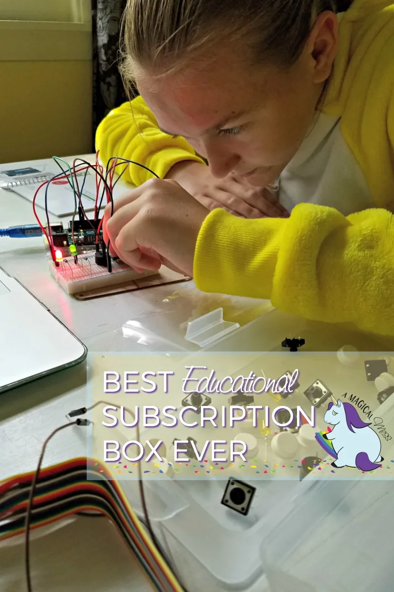 Girl placing wires into a circuit board. 