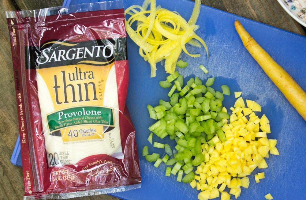 Sargento cheese and chopping veggies