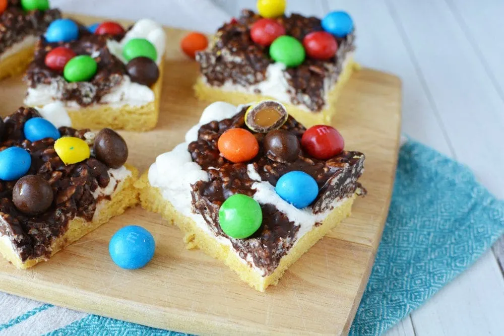 Layered cookie bars with candy.