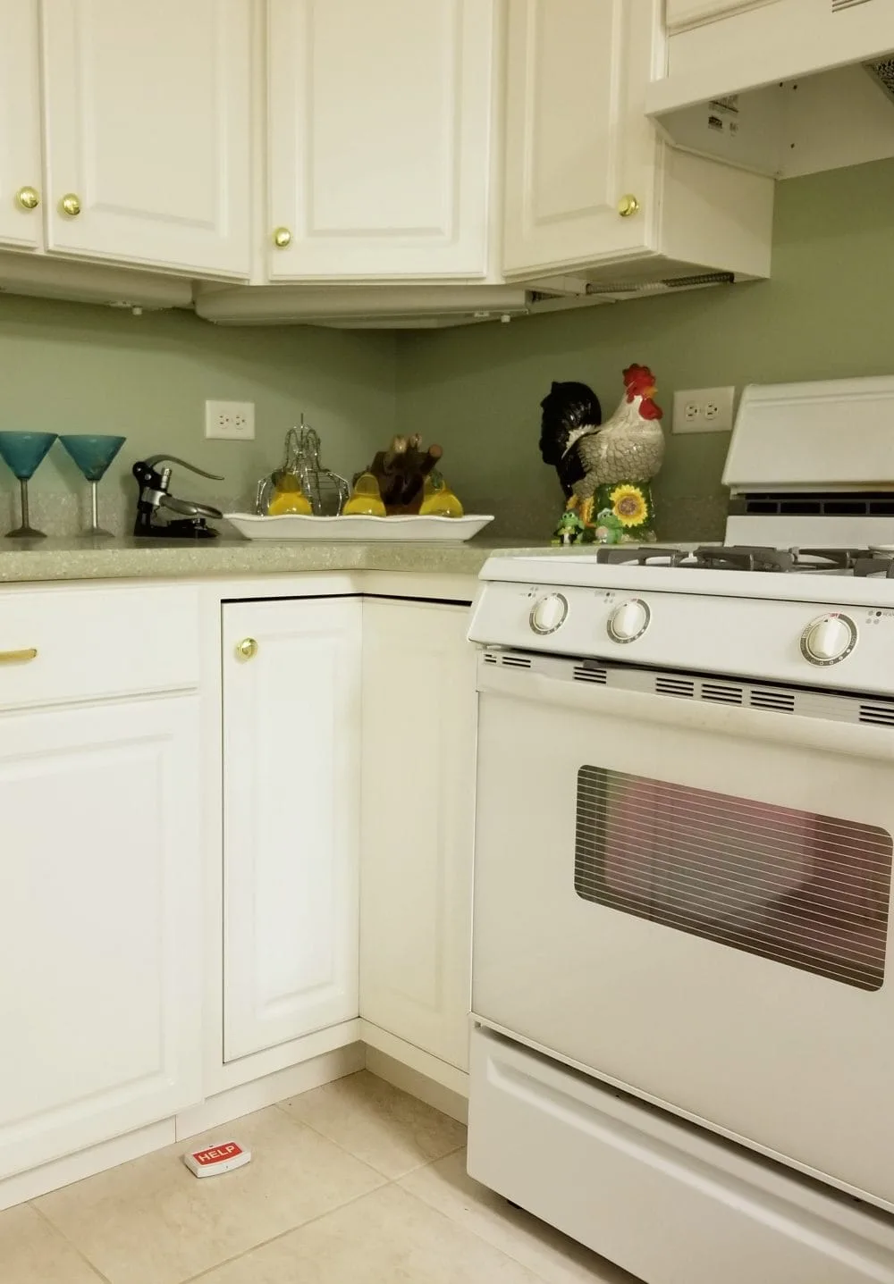 A kitchen with chicken decor. 