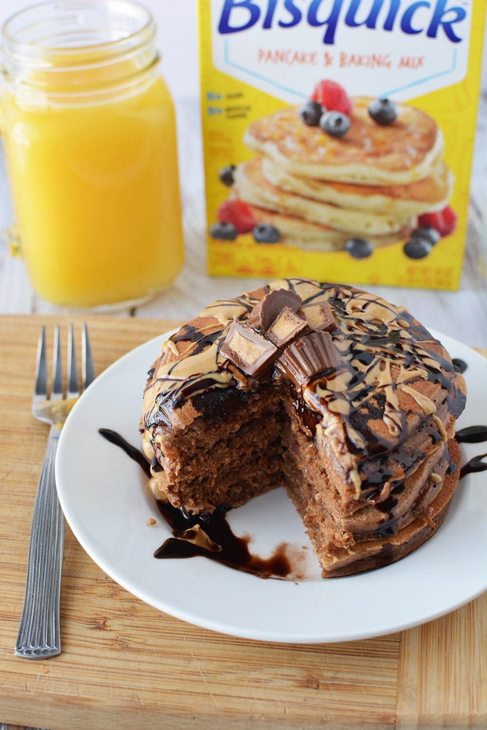 chocolate peanut butter pancakes in front of box of Bisquick