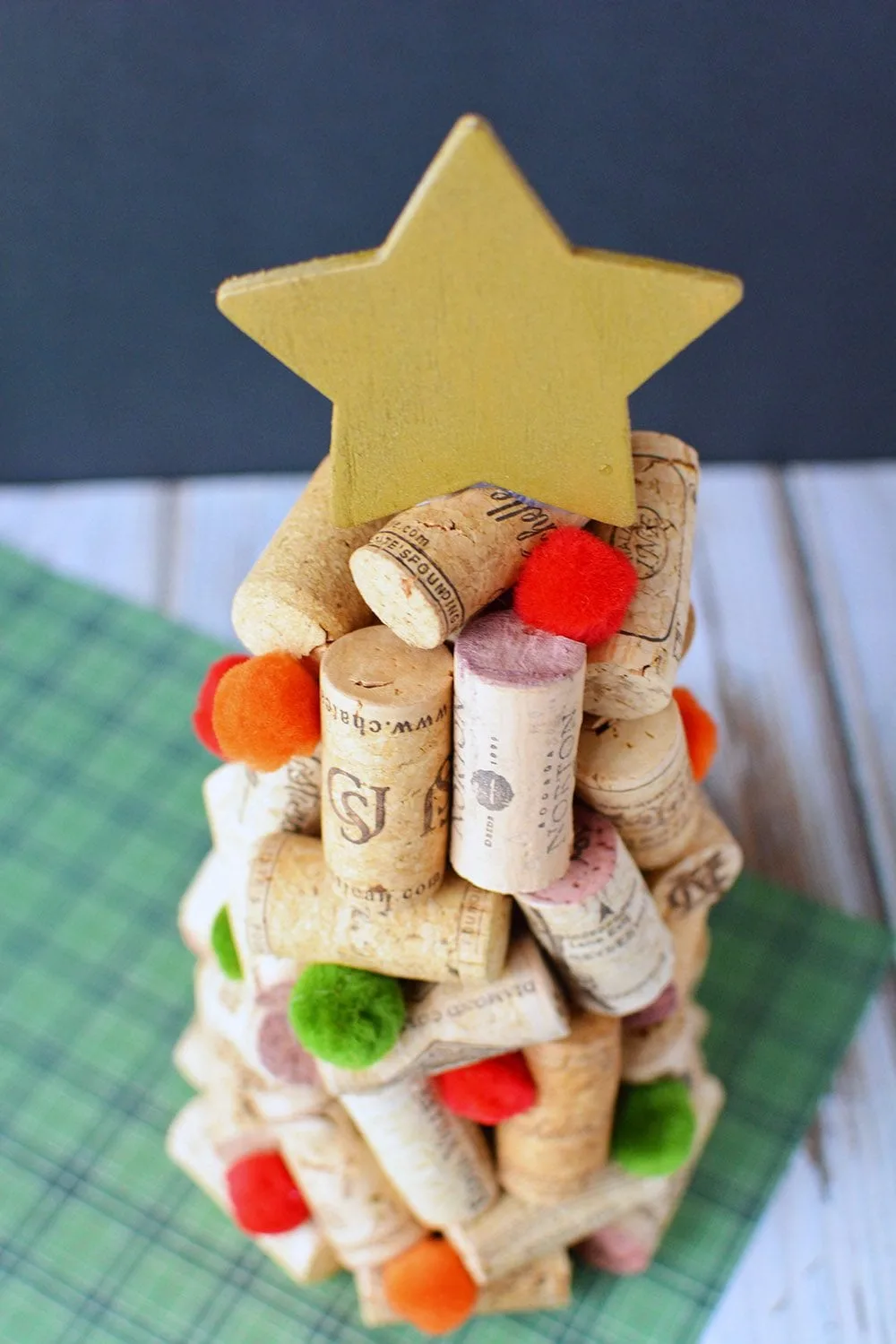 Christmas tree made out of wine corks with a wood star on top.