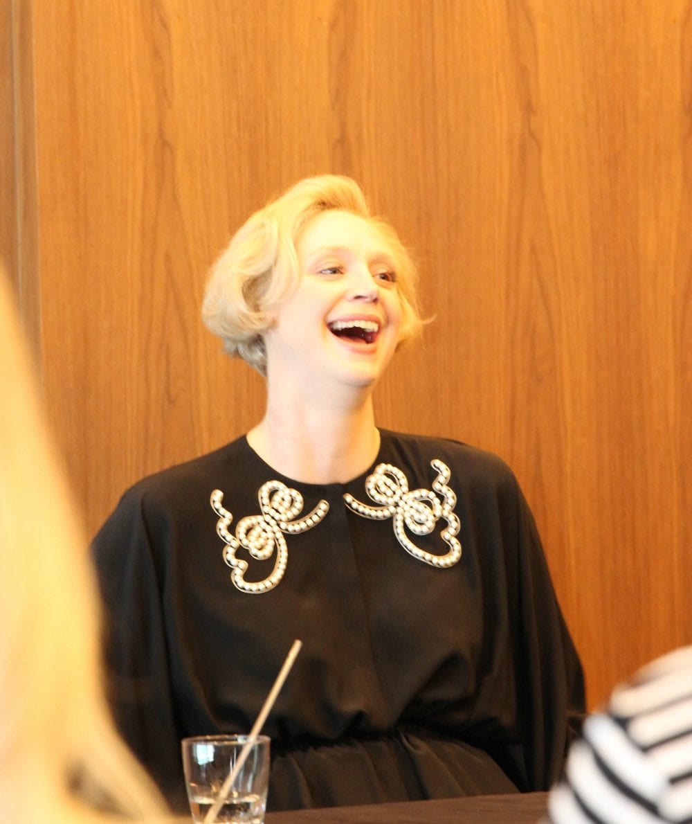 Gwendoline Christie laughing during an interview with bloggers. 