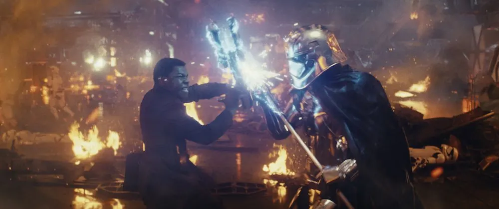 Star Wars: The Last Jedi L to R: Finn (John Boyega) battling Captain Phasma (Gwendoline Christie) Photo: Lucasfilm Ltd. © 2017 Lucasfilm Ltd. All Rights Reserved.