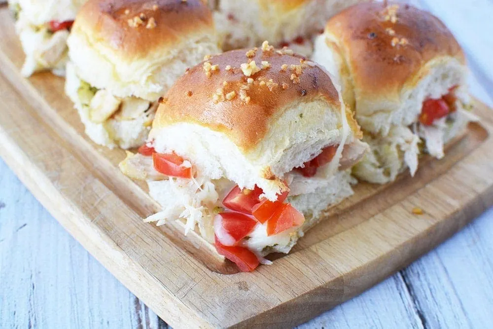 Pesto Chicken Sliders on a board. 