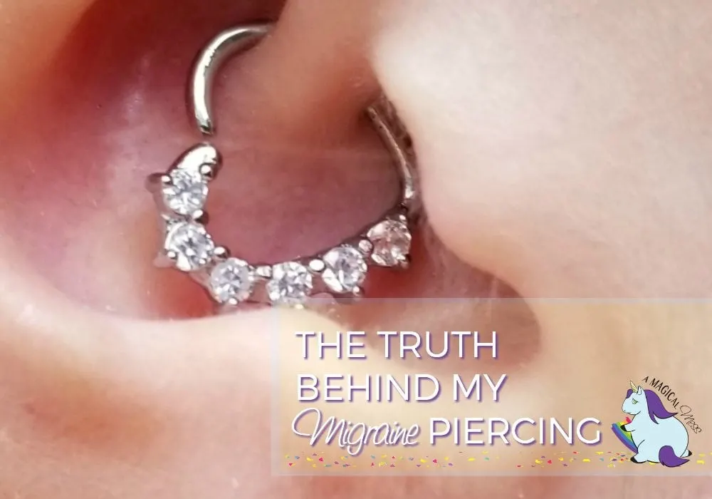 Daith piercing in an ear with a heart ring.