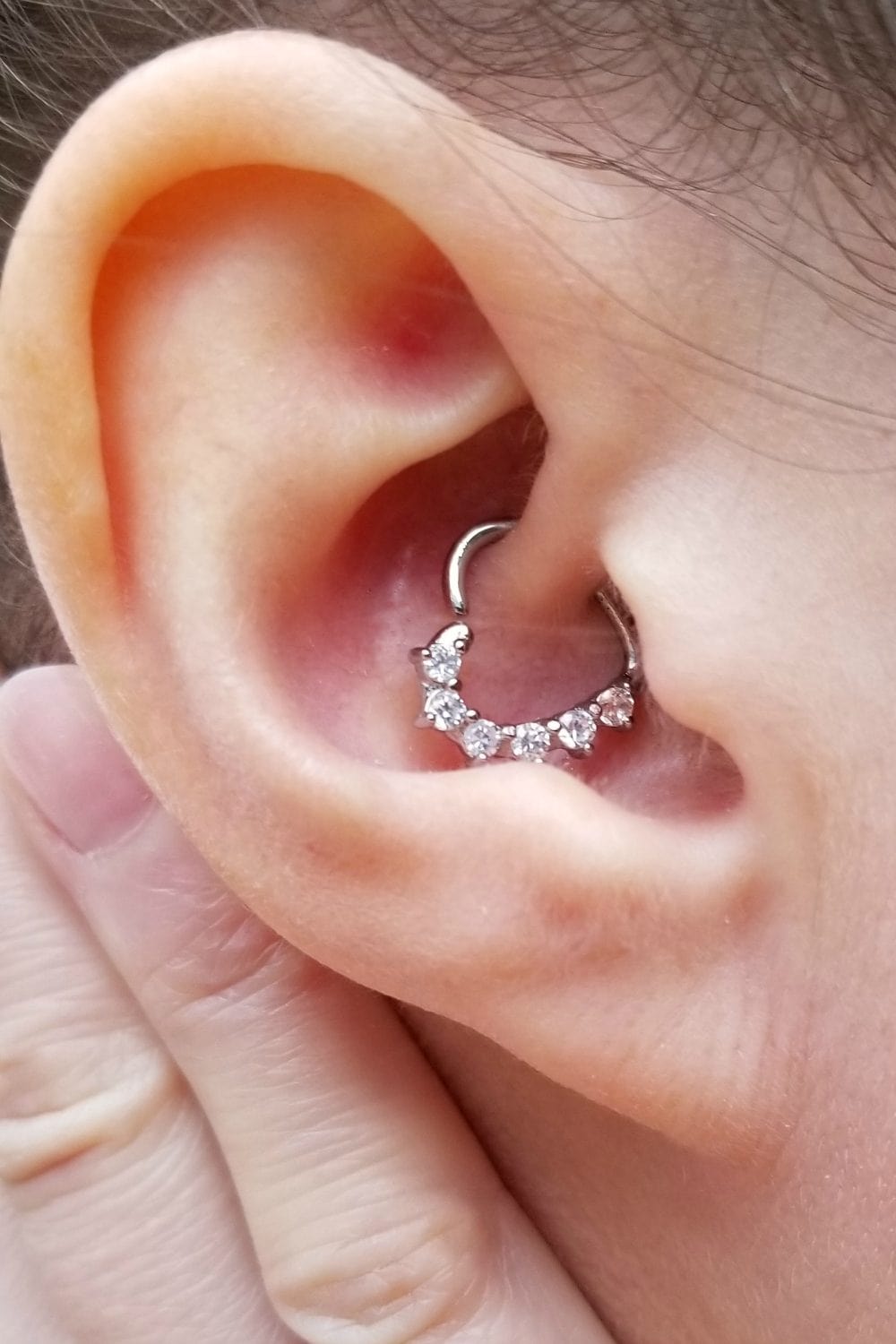 Ear with a heart-shaped daith earring.
