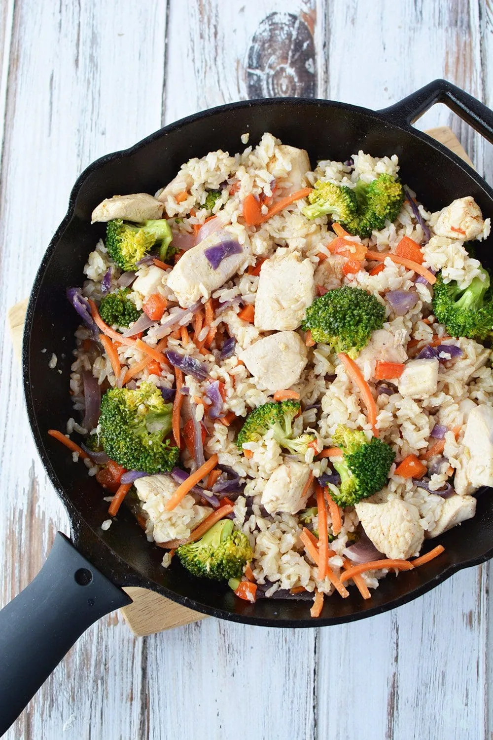 Skillet chicken with ginger, veggies, and rice.