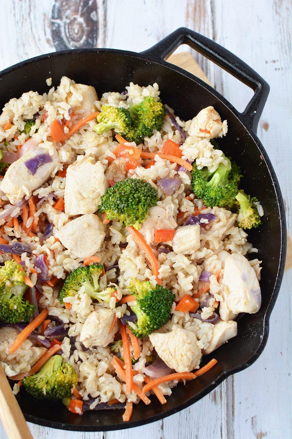 Ginger Chicken with Veggies and Rice in a skillet.