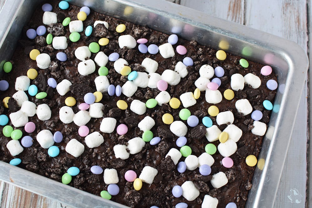 Marshmallow brownies with candy in a baking pan. 