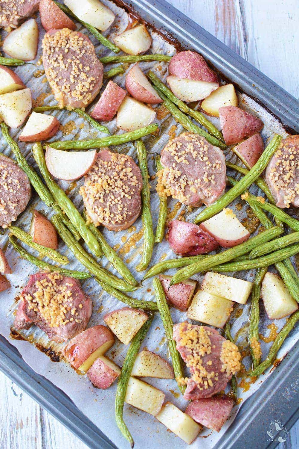 Pork sheet pan dinner with veggies and potatoes