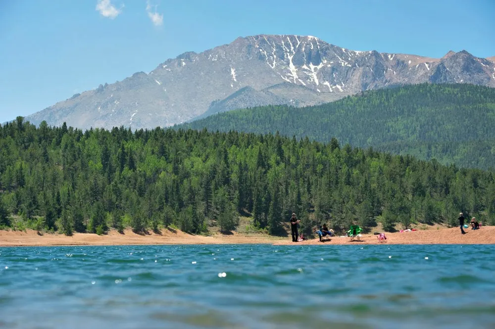Pikes Peak with lots of trees and water. 