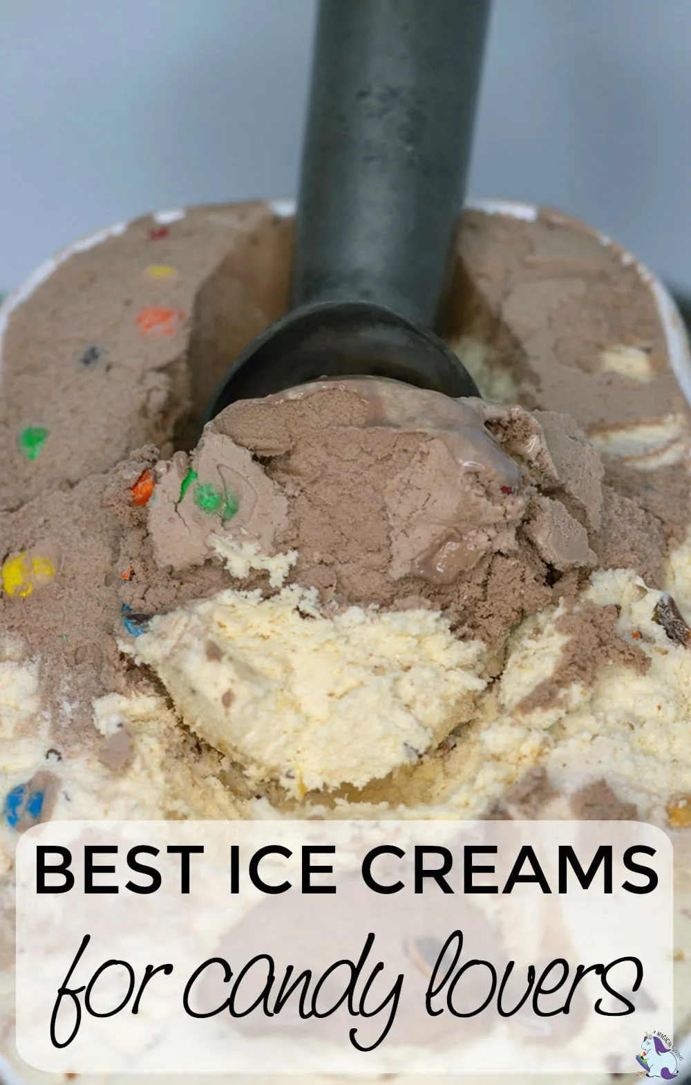 Ice cream in a tub with an ice cream scooper in it. 