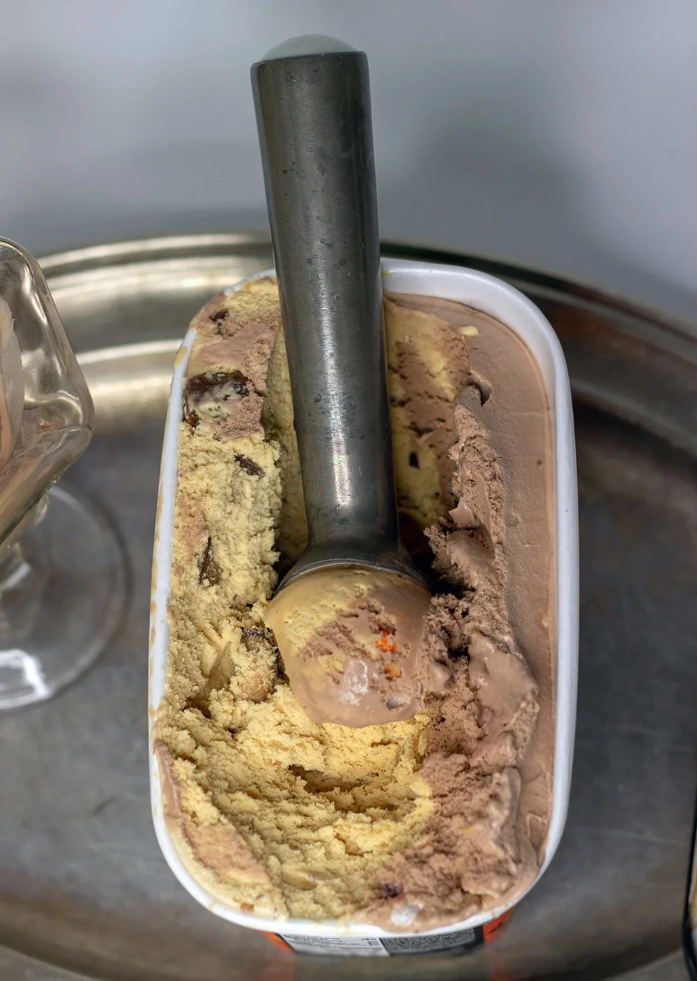 Breyer's 2-in-1 Reese's  being scooped with an ice cream scoop. 