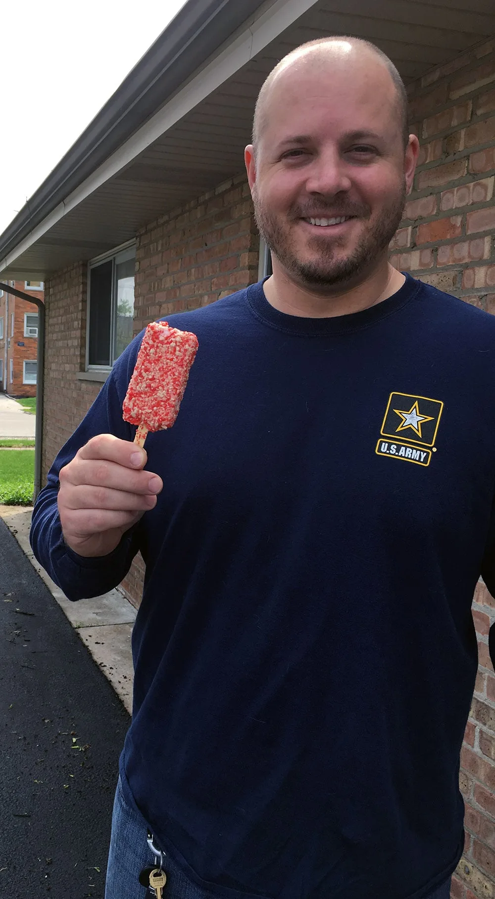 A man eating Good Humor Strawberry Shortcake.