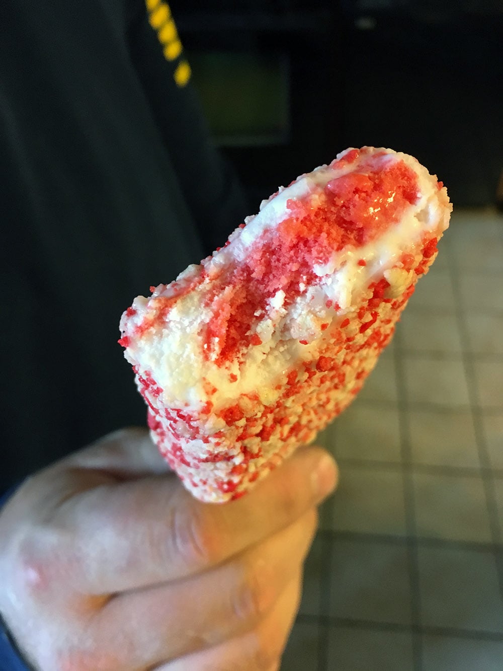 Good Humor Strawberry Shortcake with a bite taken out.