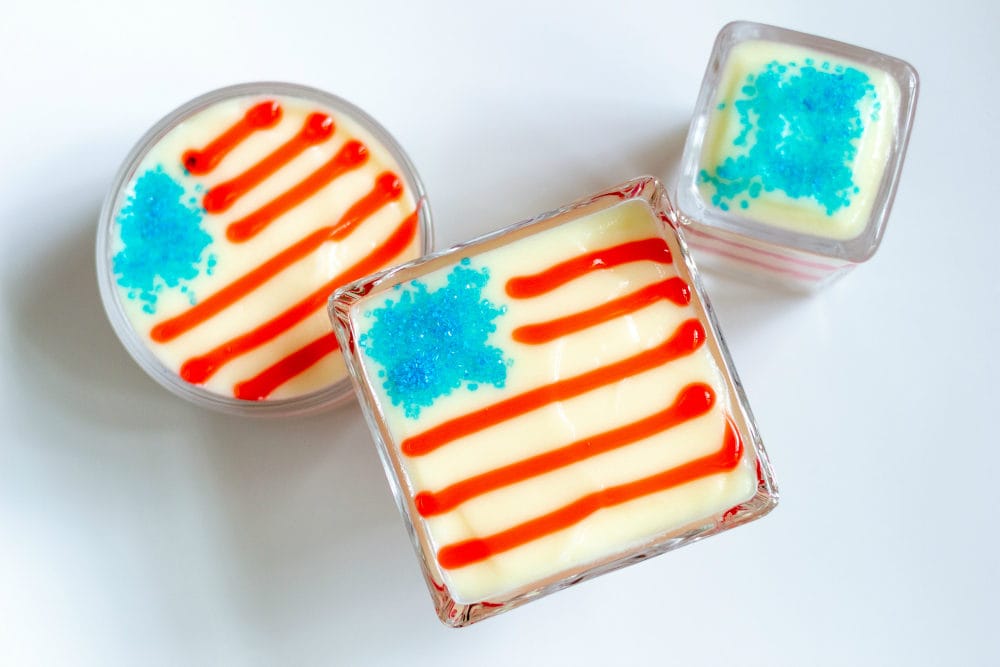 Pudding parfait desserts with flags on them.