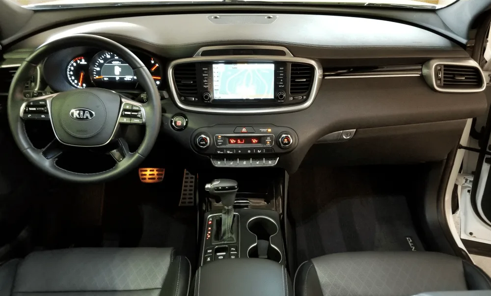 The new button layout, wireless charging pad, and steering wheel design have us drooling over the 2019 Kia Sorento. It's the best midsize SUV for the money!