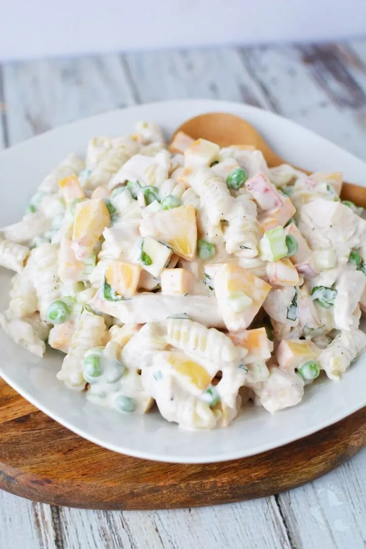 
A dish with peach and chicken pasta salad.

