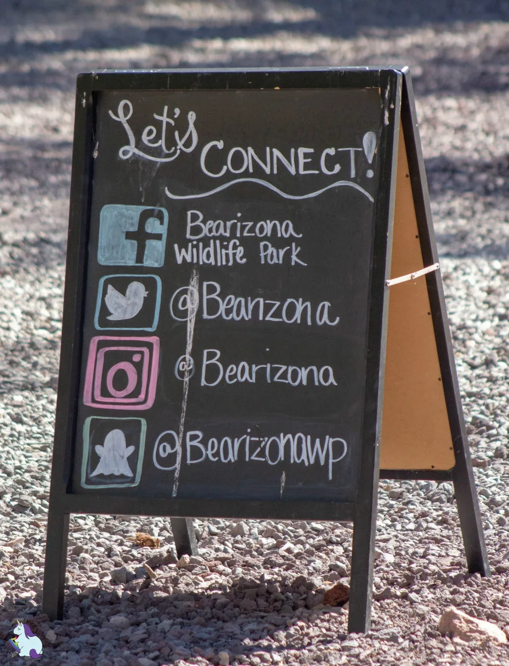 A chalkboard with Bearizona's social channels written on it. 