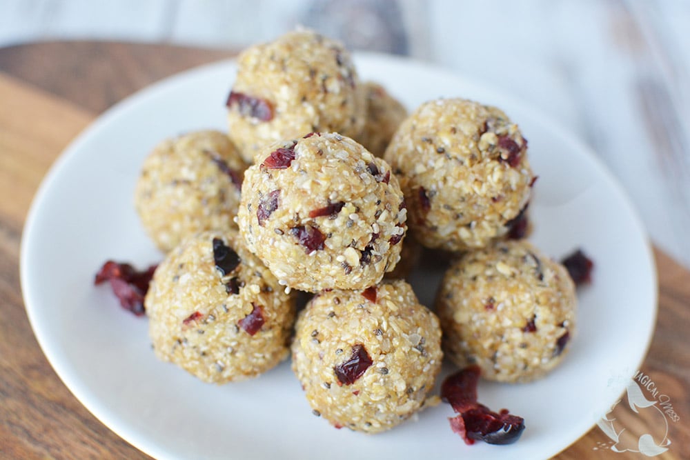 Energy bites with cranberries on a white plate. 