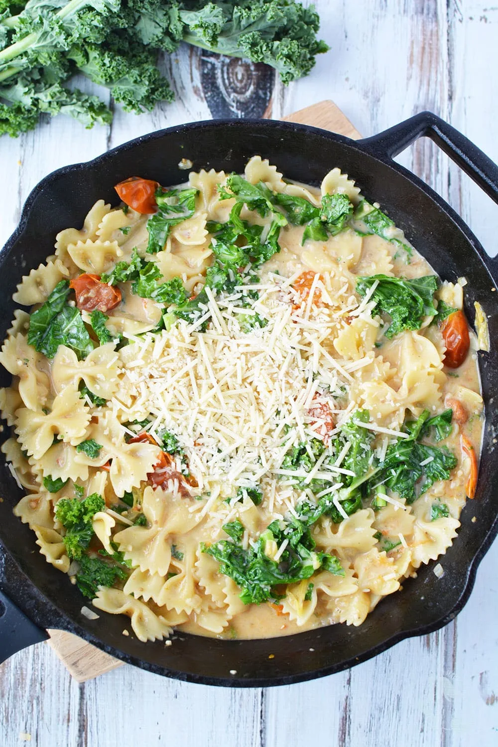Meatless pasta recipe with kale in a skillet.