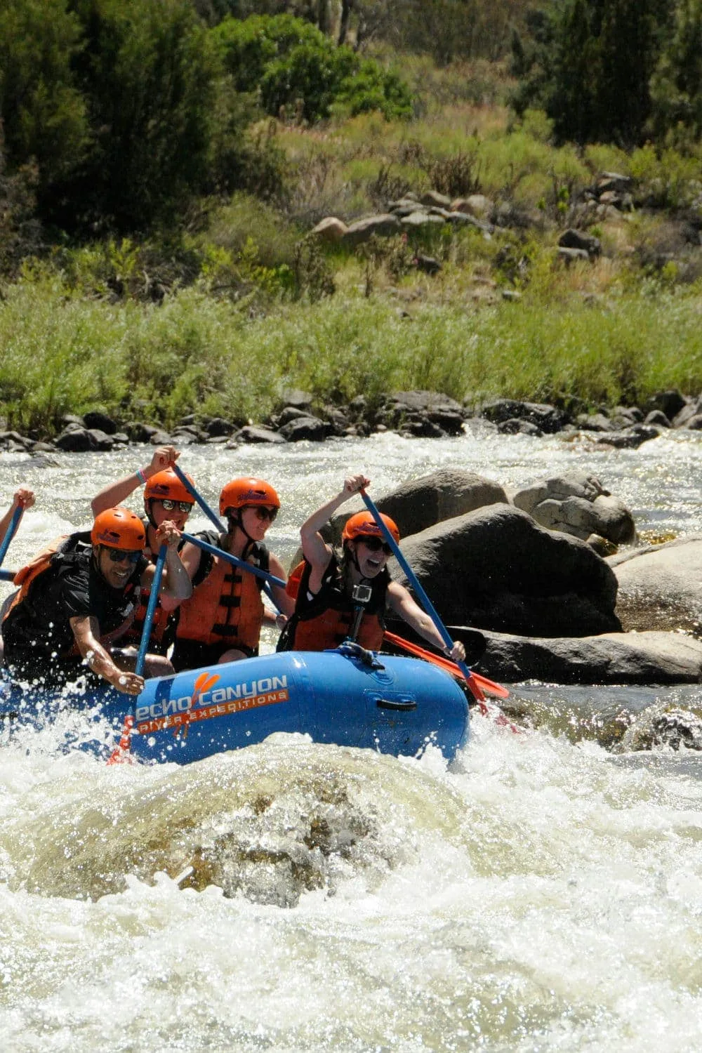 White water rafting along an intense river.