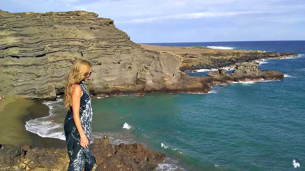 Shelley standing on the Green Sand Beach looking at the ocean. 