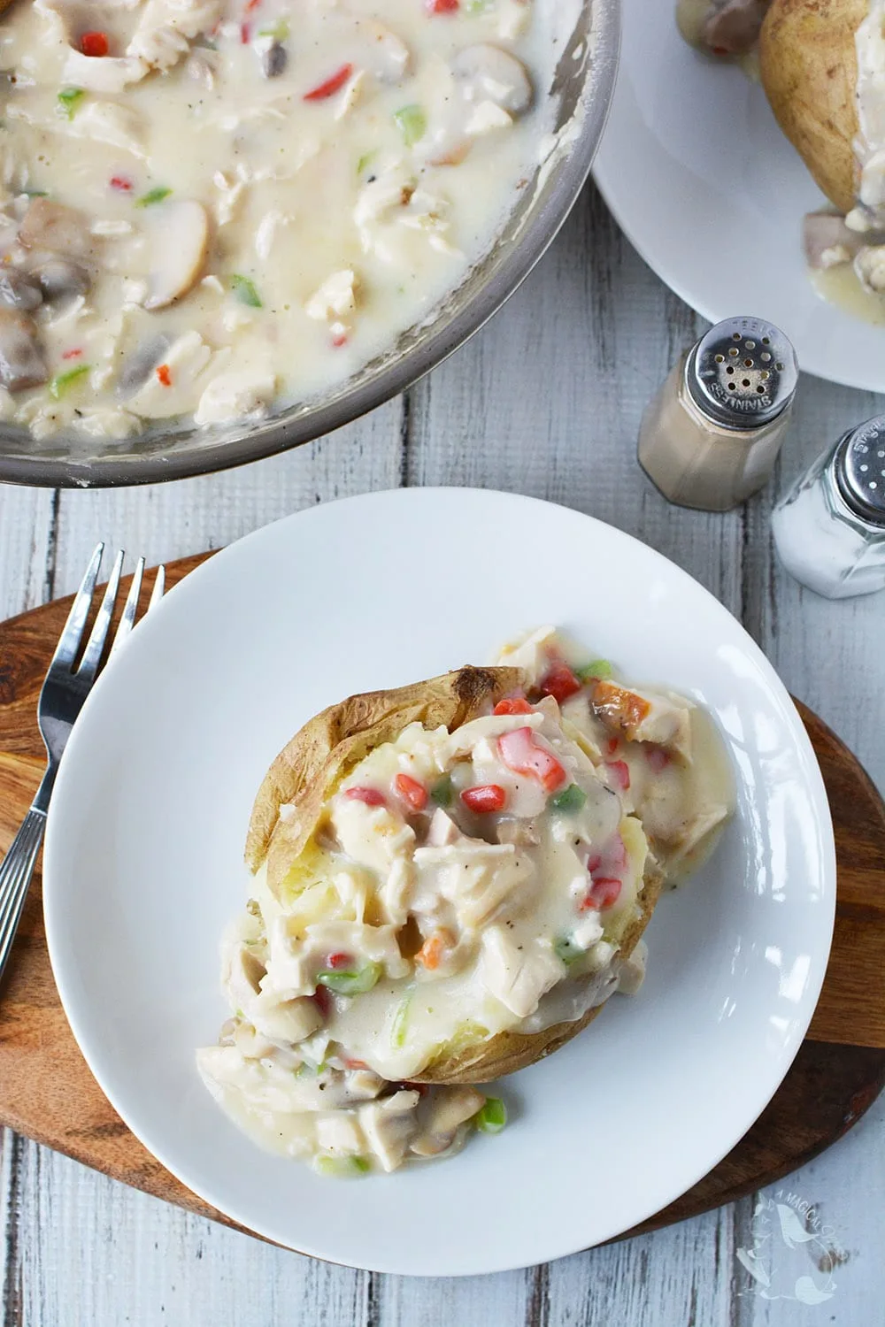 Turkey a la king in a bowl and on top of a baked potato. 