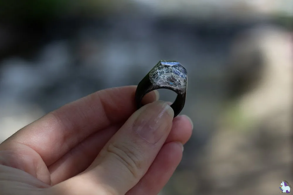Holding a resin ring from Secret Woods. 