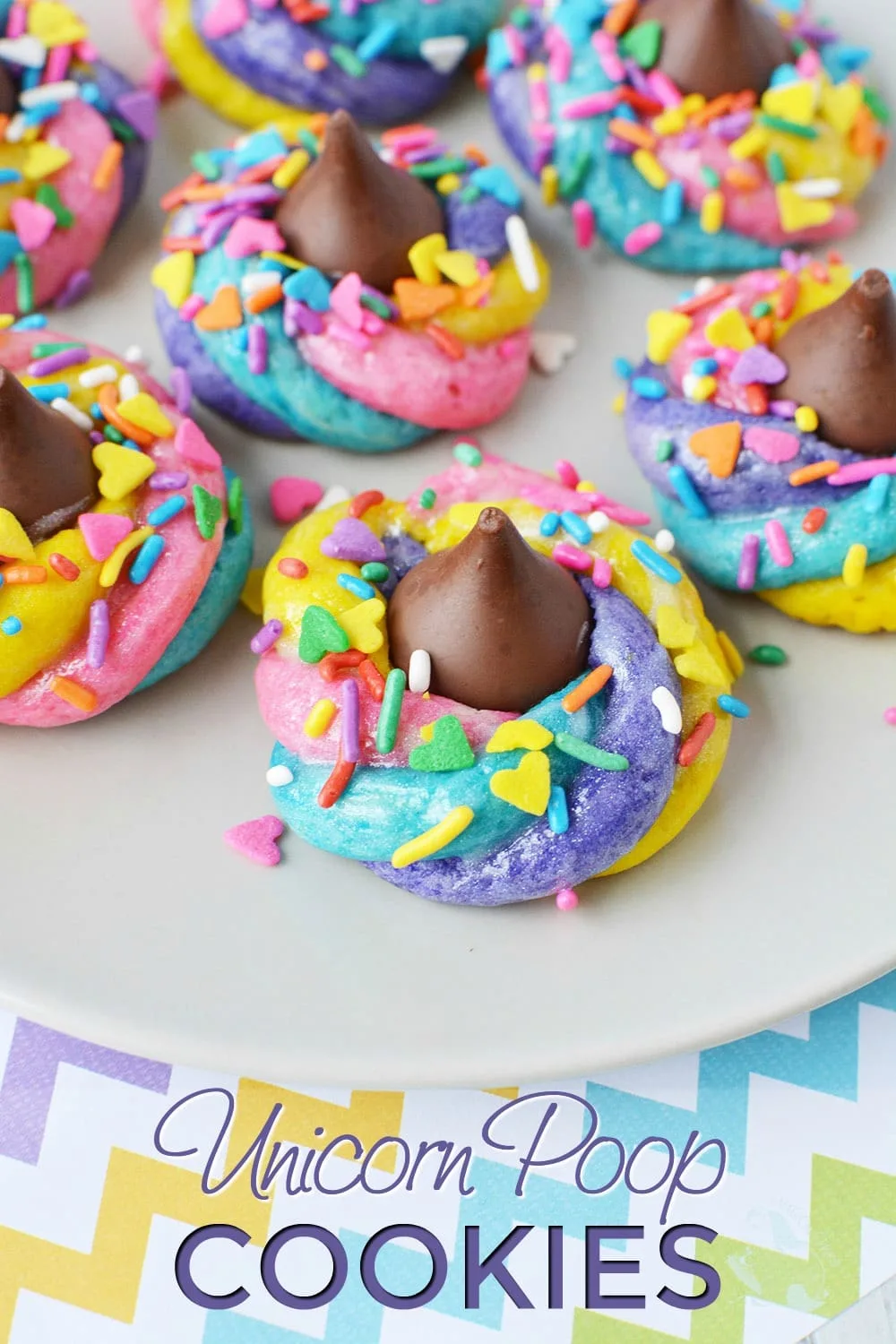 Rainbow colored swirl cookies with a chocolate kiss