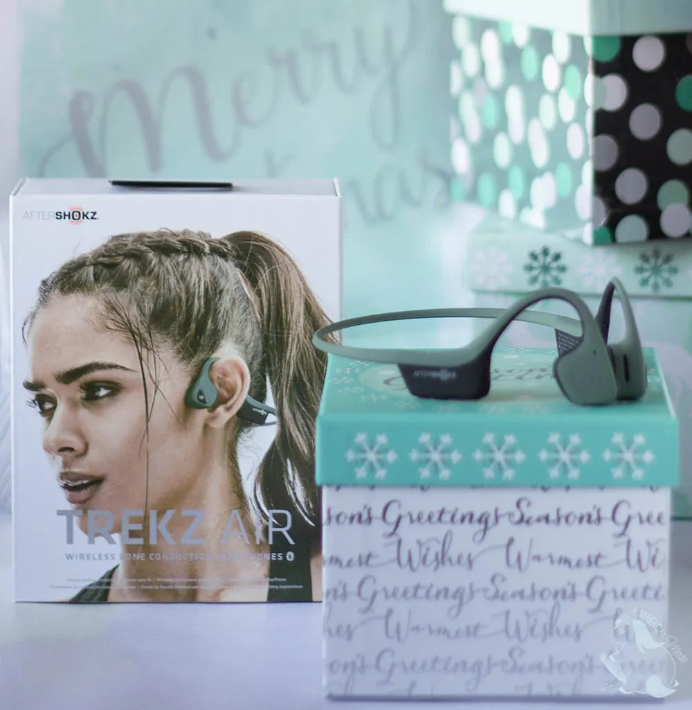 Aftershokz headphones sitting on gift box