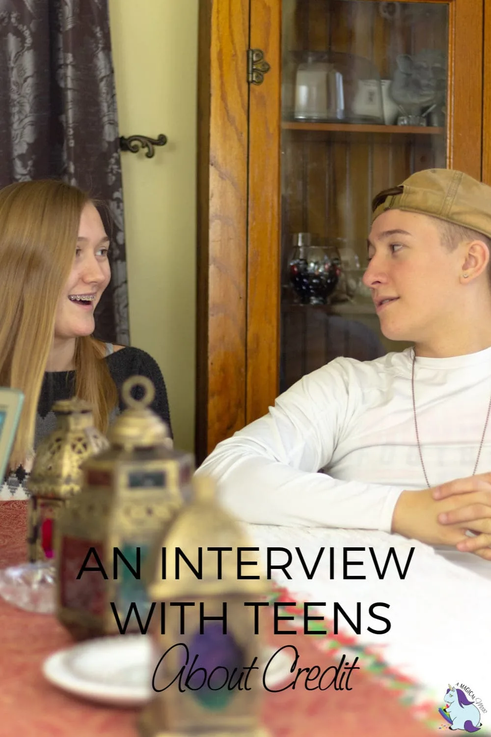 2 teens sitting at table talking