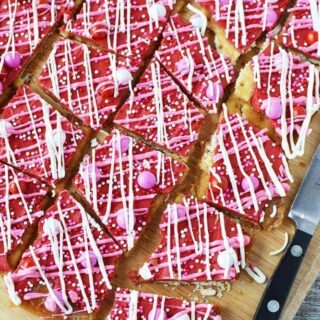 Crack candy with red and pink decorations.