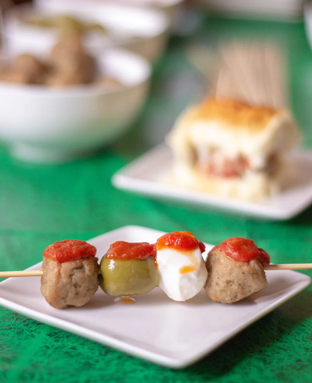 Meatball skewer with fresh mozzarella and olive.