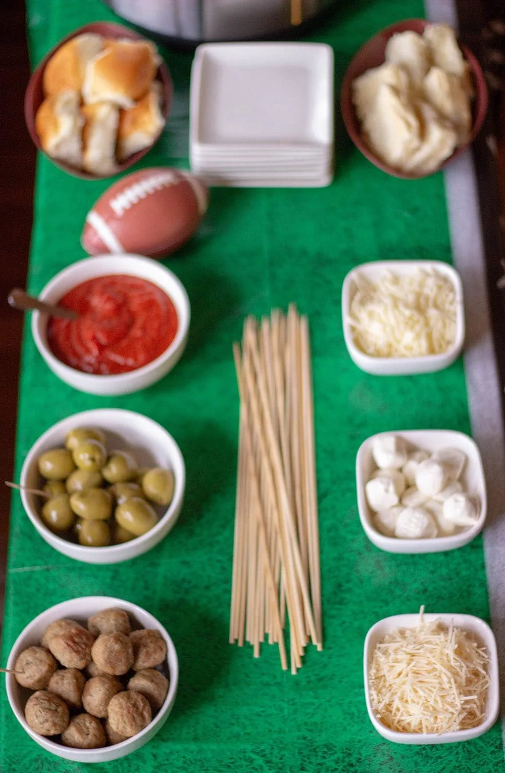 A table full of ingredients to make meatballs sliders or skewers