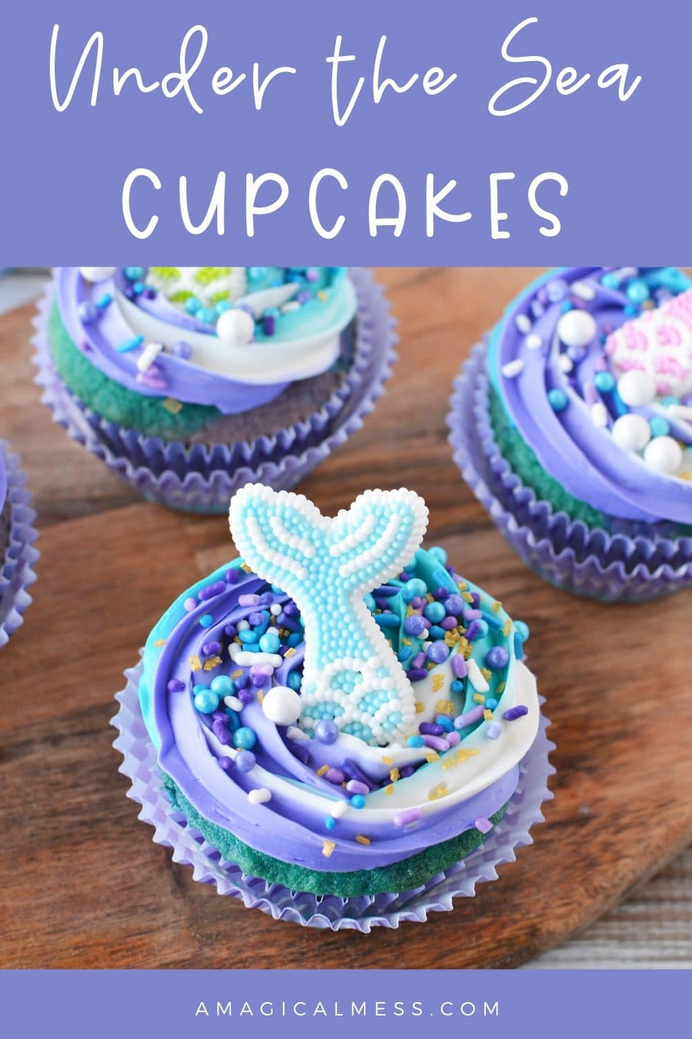 swirled blue and purple cupcakes with fins