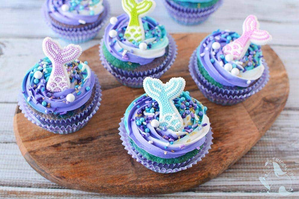 Mermaid cupcakes on a serving board.