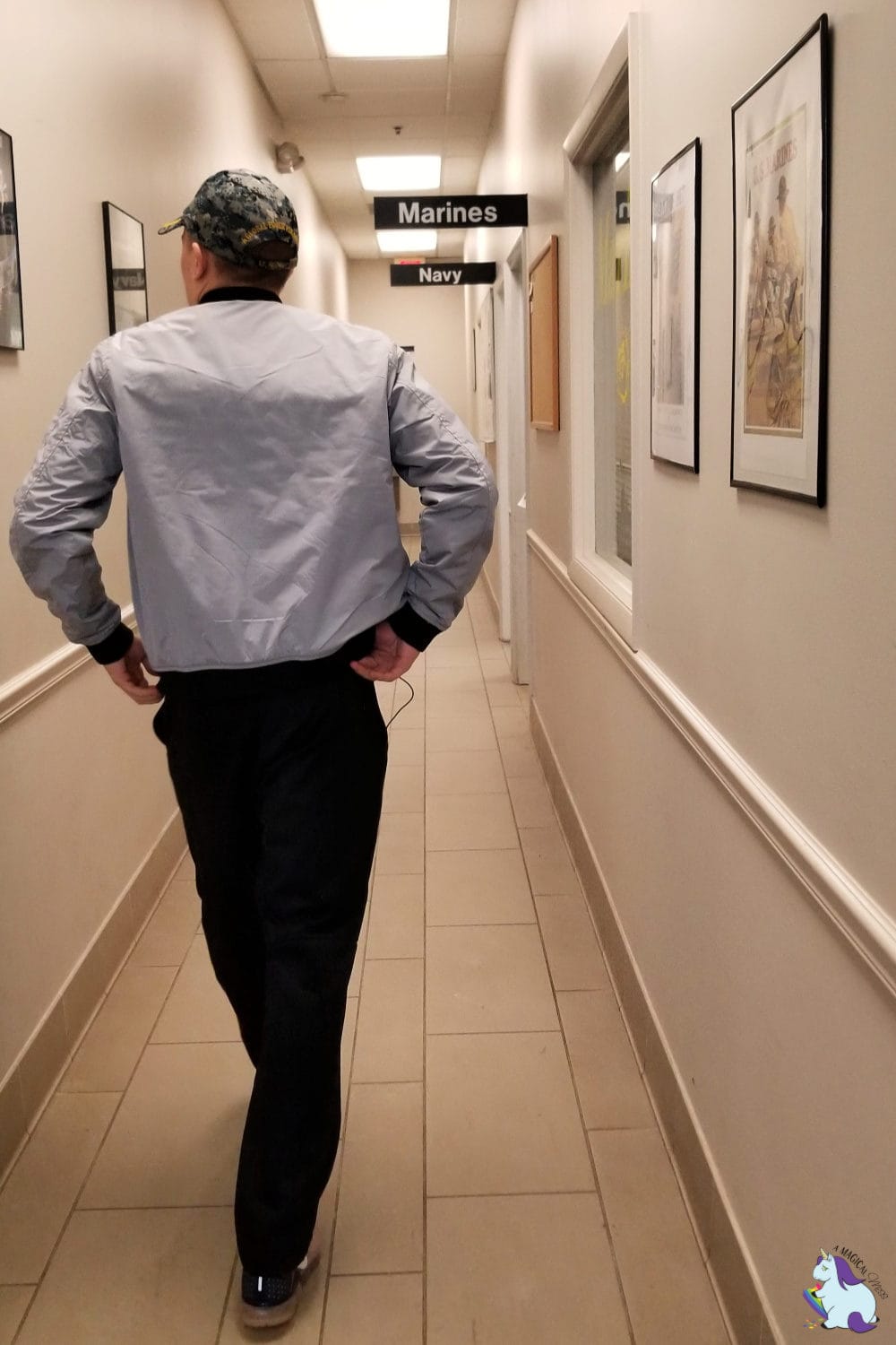 Teen boy walking down the hall to Navy recruiting office