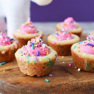 Unicorn cookie cups filled with pink frosting