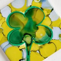 abstract four leaf clover in alcohol ink on tile