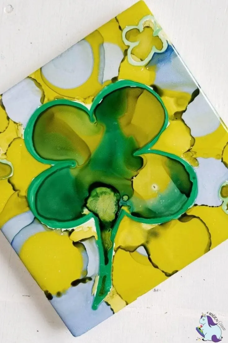 abstract four leaf clover in alcohol ink on tile
