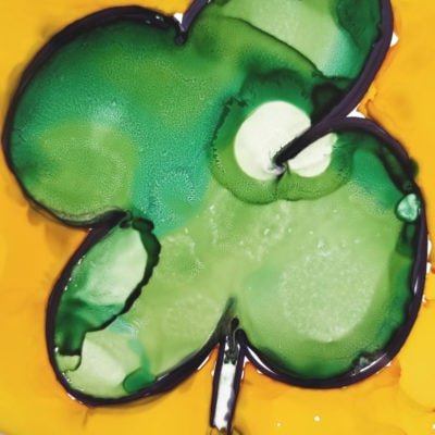 Green and yellow alcohol ink four leaf clover