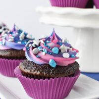 decorated cupcakes on white dishes