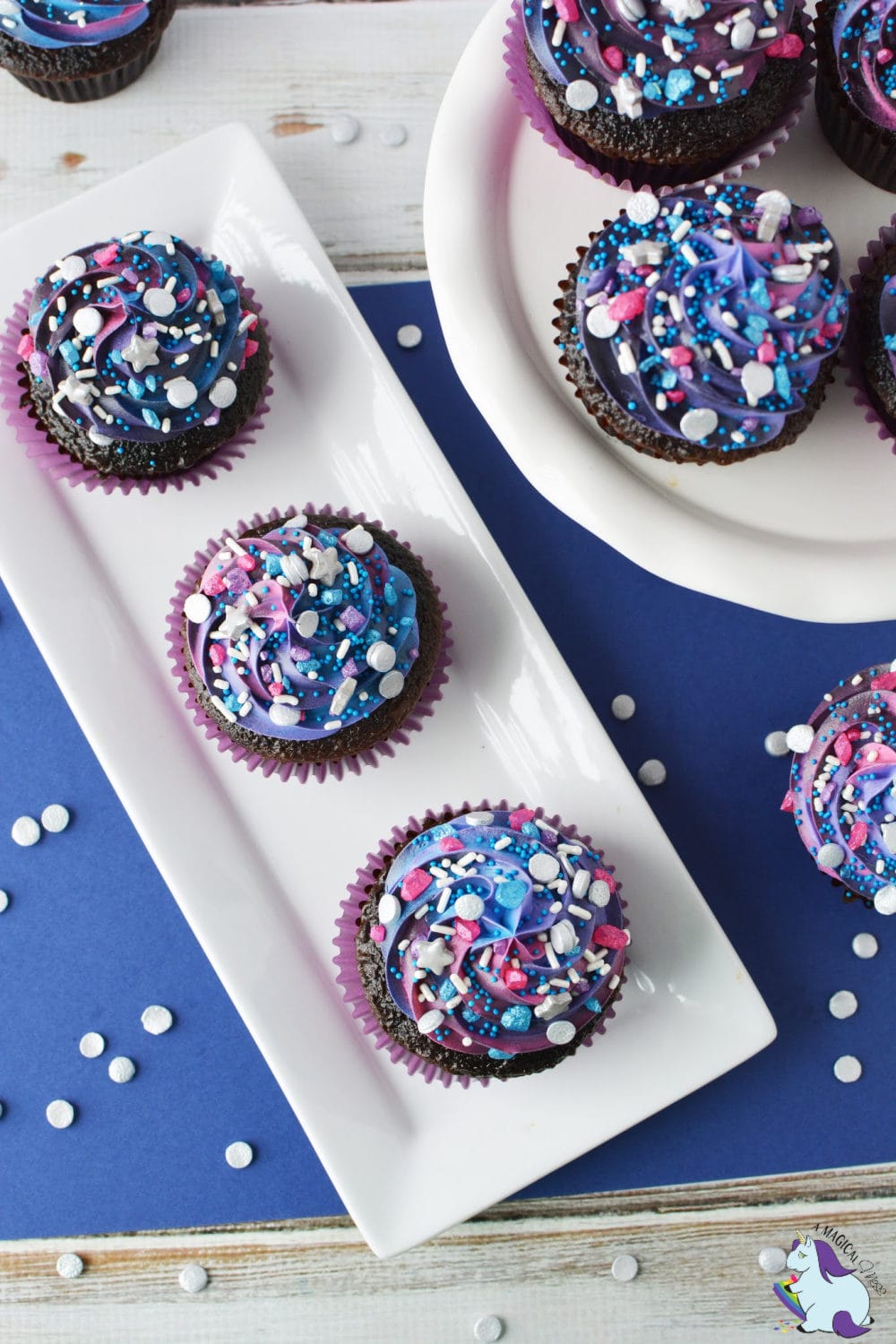 Purple, blue, and pink galaxy cupcakes.