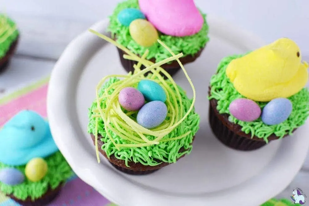 Cupcakes with edible bird's nest on top of them. 