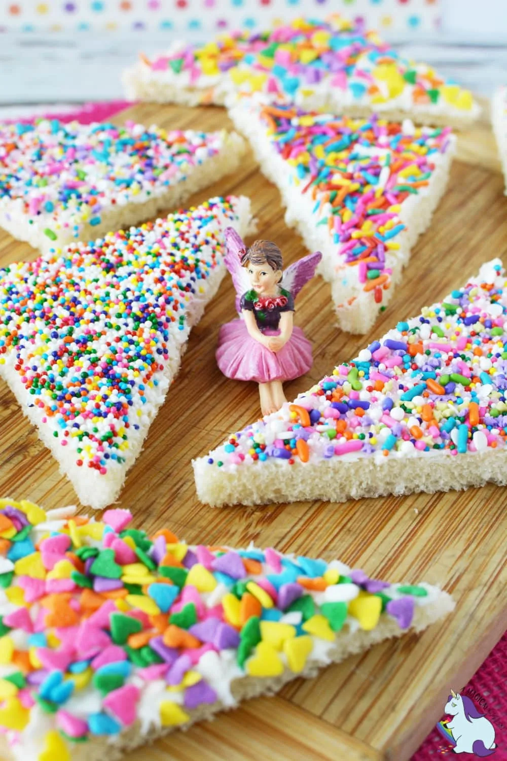 Colorful fairy bread on cutting board.