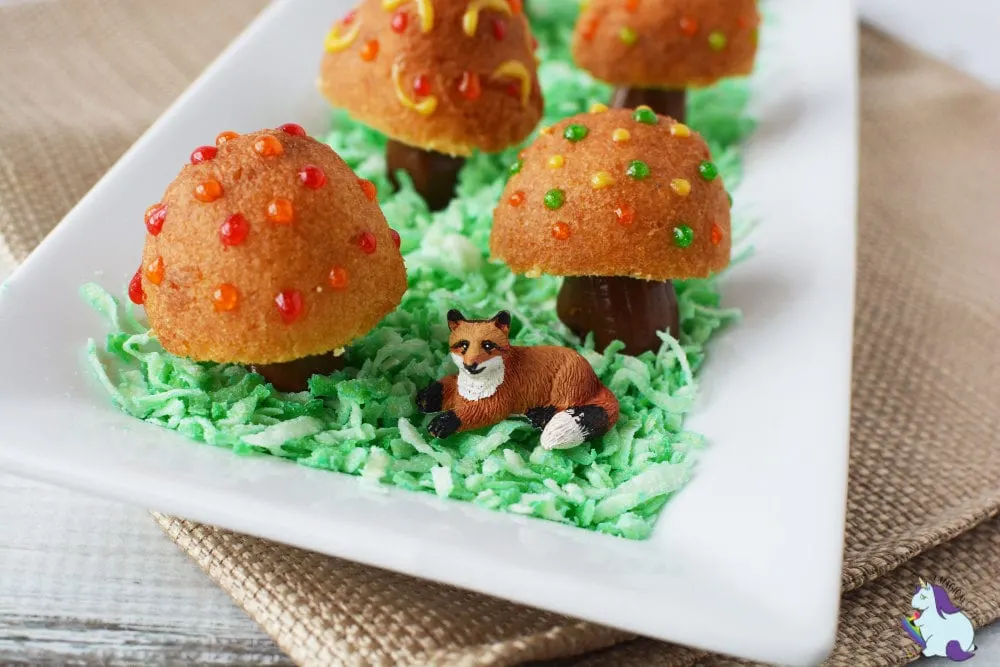 Fairy toadstools and fox on plate.