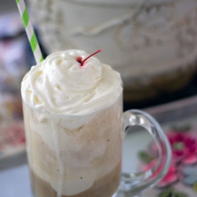 Root beer float sitting on a table.