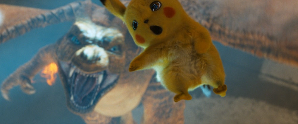 Charizard and Detective Pikachu (RYAN REYNOLDS) in Legendary Pictures' and Warner Bros. Pictures' comedy adventure "POKÉMON DETECTIVE PIKACHU," a Warner Bros. Pictures release.
